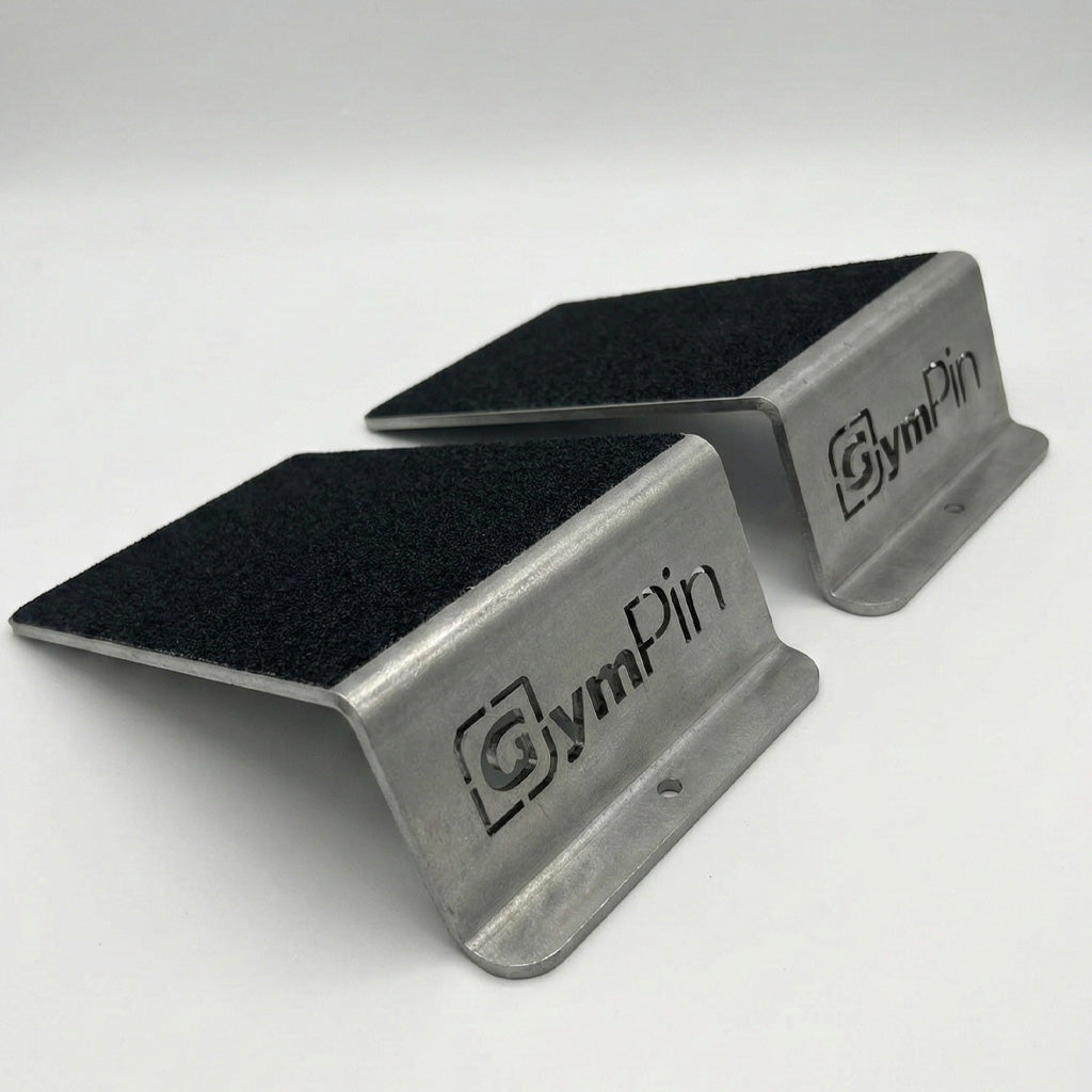 GymPin Steel Squat Wedges with grip tape. Professional grade heel ramps for squats and calf raises, featuring laser-cut branding and durable metal construction.