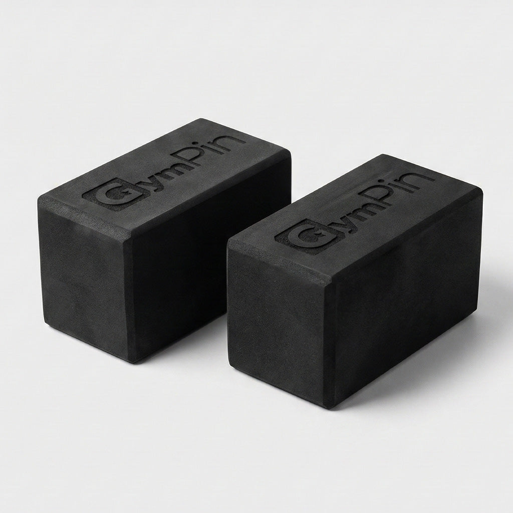 Pair of GymPin Starting Blocks made from dense black foam with embossed GymPin branding, used to elevate machine start positions and improve range of motion during training.
